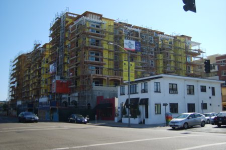 [image of large, multi-unit residential building under construction on 5th Avenue in Hillcrest]