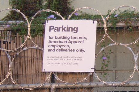 [image of razor wire protecting American Apparel location]