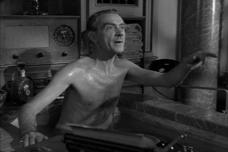 [Clifton Webb, in tub, with bit of swim-suit showing]